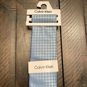 Calvin Klein blue tie. NWT.
